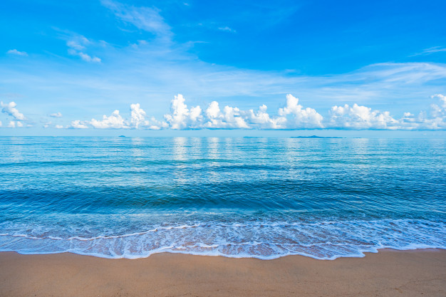 beautiful-tropical-beach-sea-ocean-with-white-cloud-blue-sky-copyspace_74190-8663